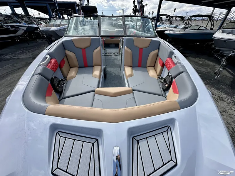 Slide: The Image of 2024 MasterCraft XT24 boat interior with stylish seating and modern design. - 5