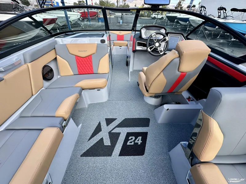 Slide: The Image of Interior of 2024 MasterCraft XT24 boat with modern seating and dashboard. - 6