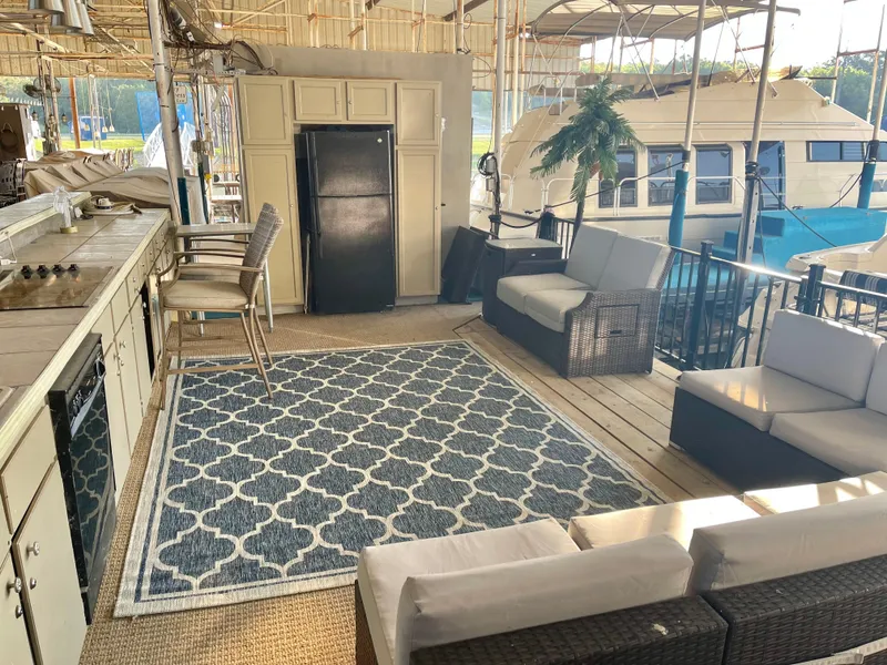 Slide: The Image of Luxurious 2004 Regal Commodore 3560 IO yacht interior with kitchen, seating, and elegant decor. - 7