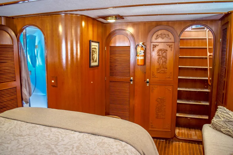 Slide: The Image of Luxurious wooden interior of 1984 Angel Defever LRC yacht cabin with carved doors. - 15