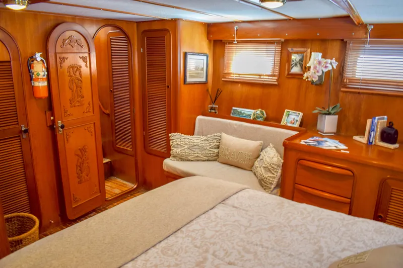 Slide: The Image of Cozy 1984 Angel Defever LRC yacht cabin with wood paneling and elegant decor. - 17