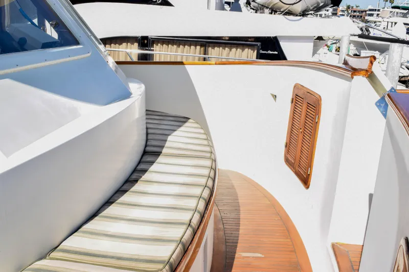 Slide: The Image of 1984 Angel Defever LRC yacht with striped seating and wooden deck details. - 4