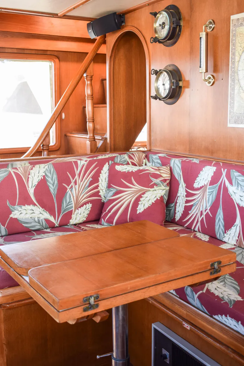 Slide: The Image of Vintage 1984 Angel Defever LRC yacht interior with floral upholstery and wooden table. - 7