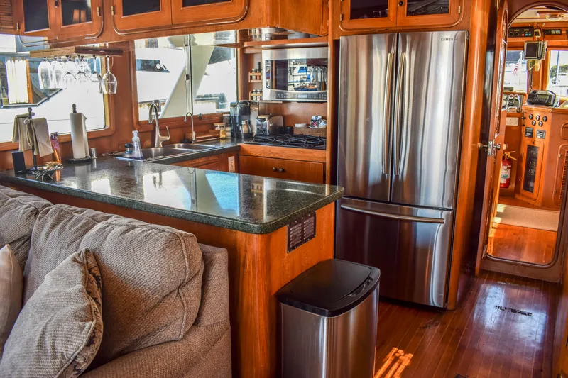 Slide: The Image of Luxurious 1984 Angel Defever LRC yacht interior with modern kitchen and stainless steel appliances. - 9