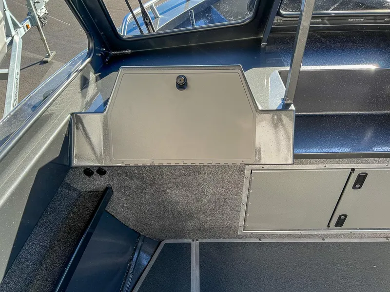 Slide: The Image of 2024 North River 25 Seahawk interior detail, featuring storage compartments and sleek design. - 10