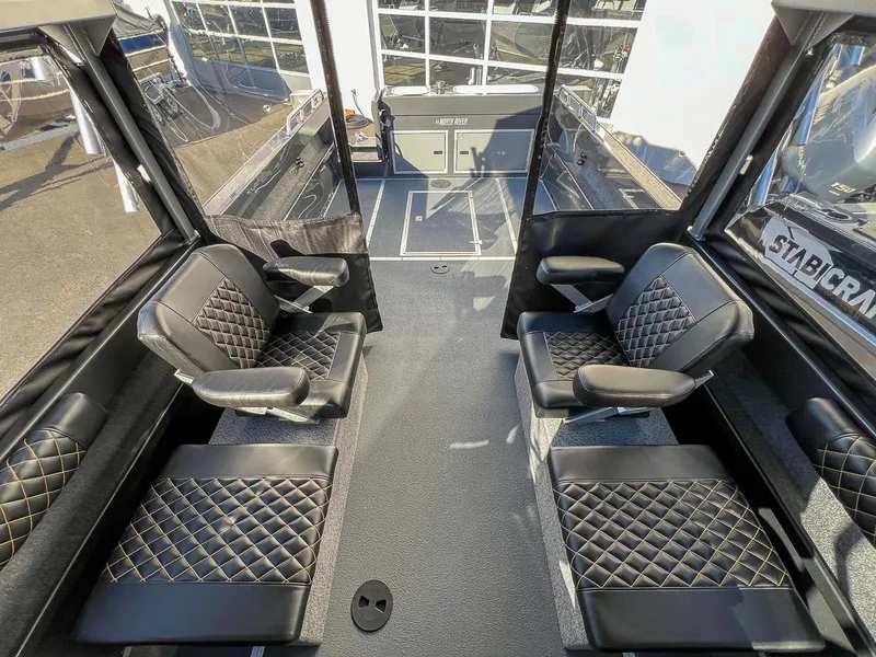 Slide: The Image of 2024 North River 25 Seahawk interior with luxurious black diamond-stitched seating. - 13