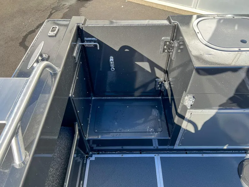 Slide: The Image of 2024 North River 25 Seahawk boat storage compartment, open and empty. - 21