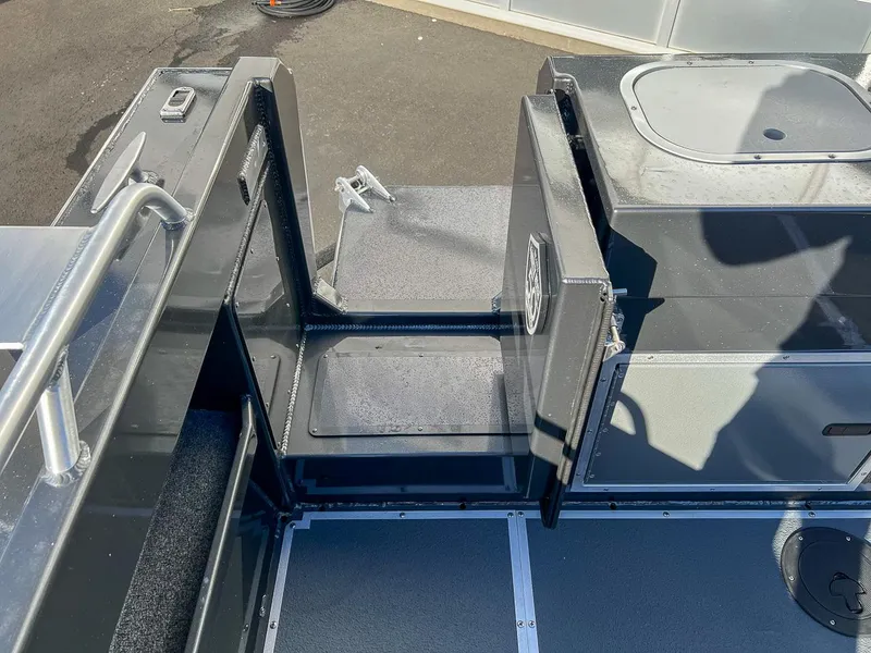 Slide: The Image of 2024 North River 25 Seahawk boat interior with open hatch and railing. - 22