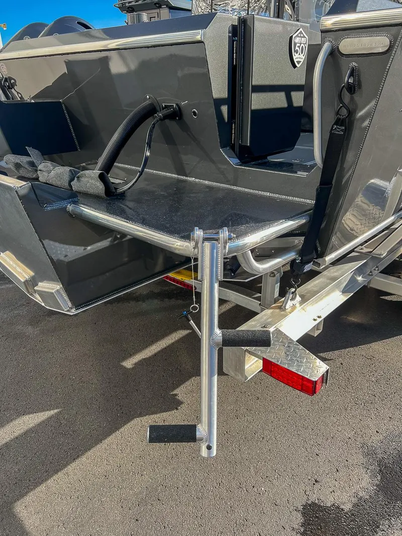 Slide: The Image of 2024 North River 25 Seahawk boat stern with ladder and trailer detail. - 23