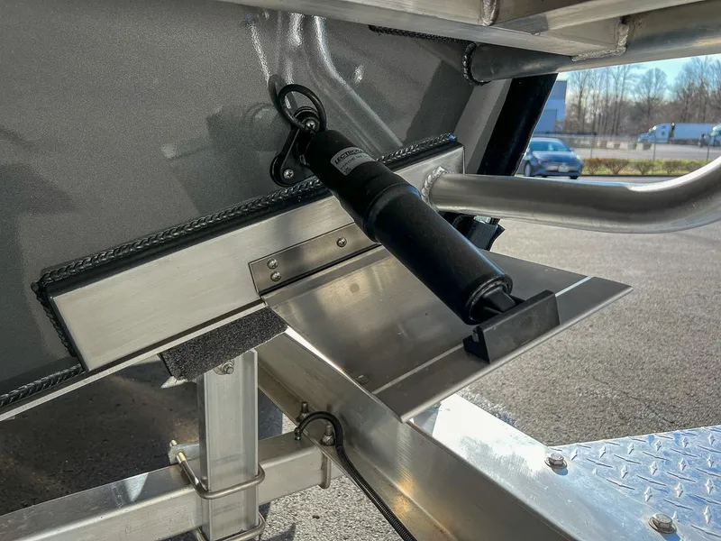 Slide: The Image of 2024 North River 25 Seahawk boat detail, featuring hydraulic components and metal framework. - 24