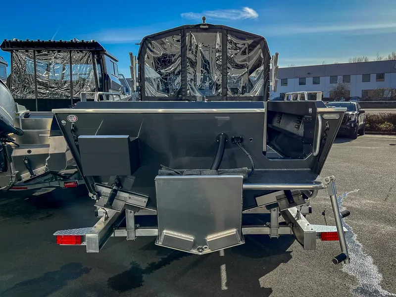 Slide: The Image of 2024 North River 25 Seahawk boat rear view in a parking lot. - 4