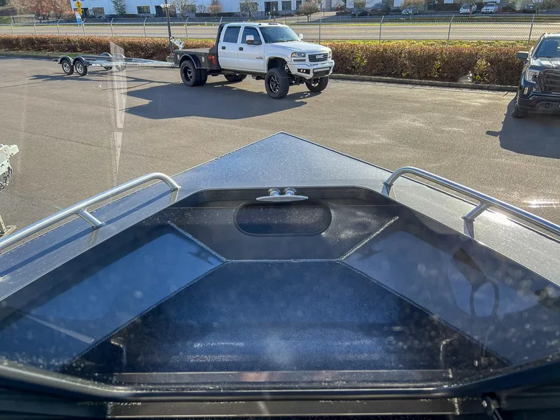 Slide: The Image of 2024 North River 25 Seahawk boat with truck and trailer in parking lot. - 7