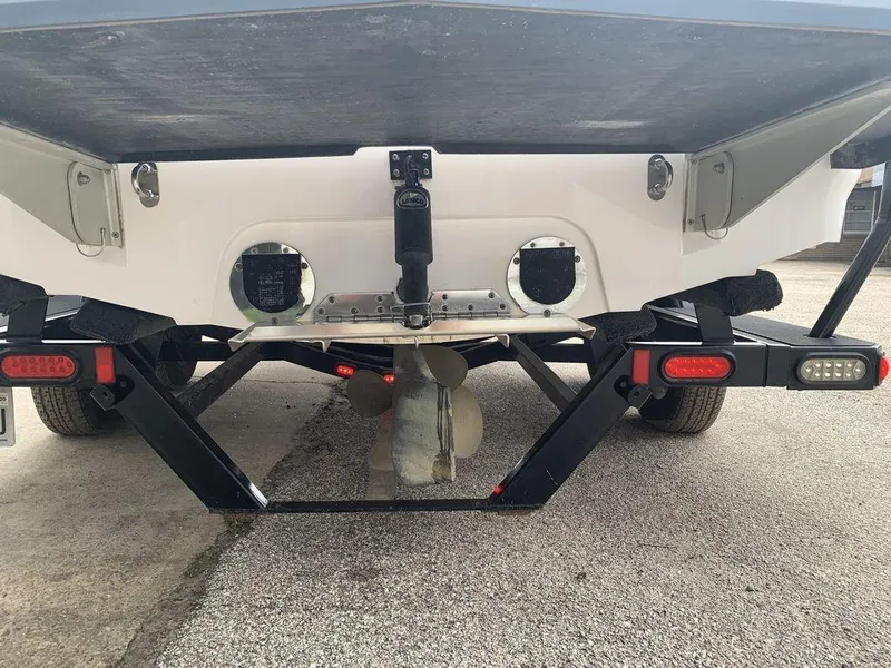 Slide: The Image of Rear view of a 2012 MasterCraft X2 boat on a trailer. - 2