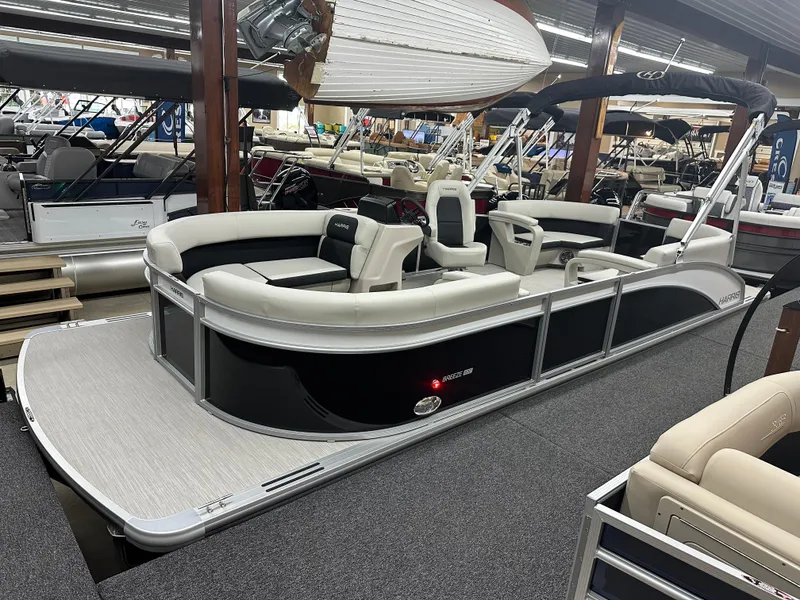 The Image of 2024 Harris Breeze 230 pontoon boat in showroom. - 1
