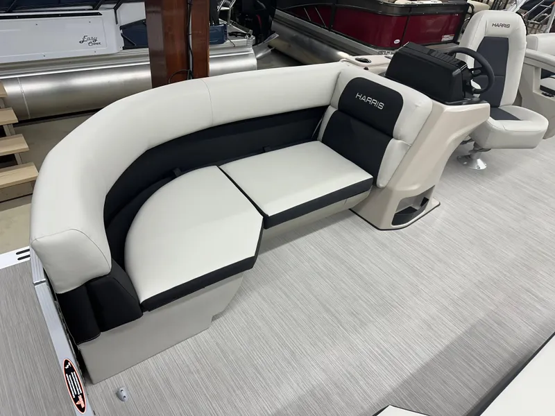 Slide: The Image of 2024 Harris Breeze 230 boat interior with plush seating and modern design. - 4