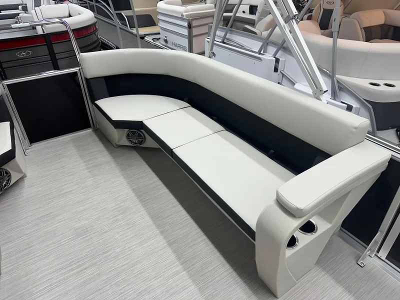 Slide: The Image of 2024 Harris Breeze 230 pontoon boat with spacious seating and modern design. - 5