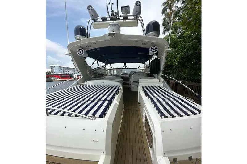 Slide: The Image of 2004 Fairline Targa 52 yacht with striped sunbeds and spacious deck. - 3