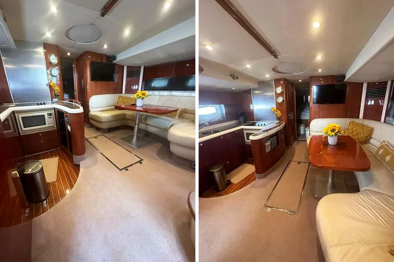 Slide: The Image of Interior of 2004 Fairline Targa 52 yacht with modern kitchen and cozy seating area. - 5