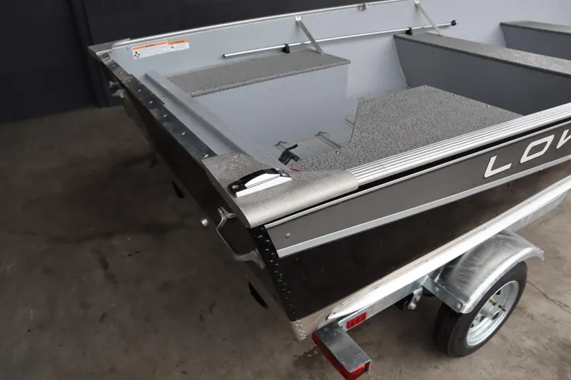 Slide: The Image of 2024 Lowe WV1670 aluminum fishing boat on a trailer. - 10