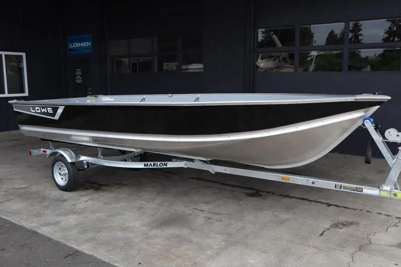 Slide: The Image of 2024 Lowe WV1670 boat on Marlon trailer in showroom. - 2
