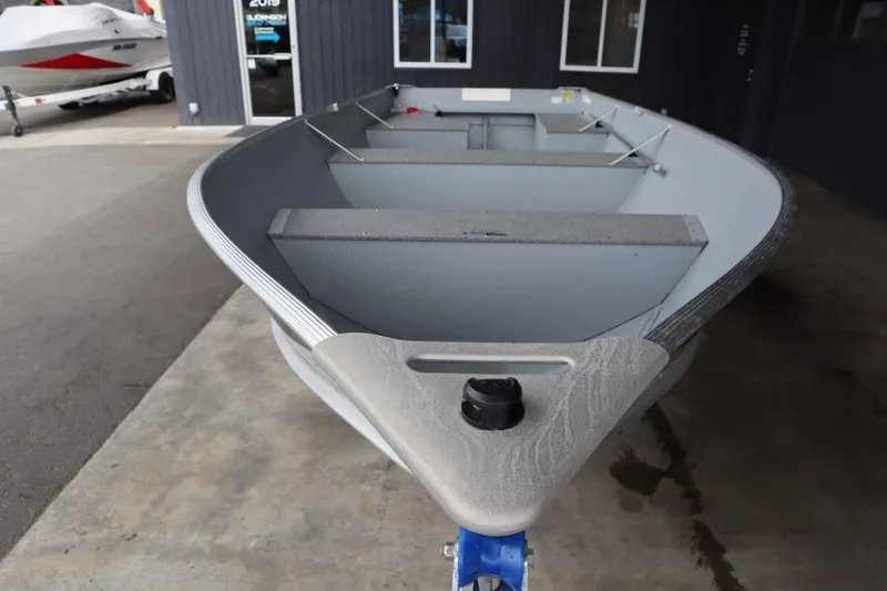 Slide: The Image of 2024 Lowe WV1670 aluminum fishing boat in showroom. - 6
