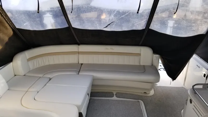 Slide: The Image of 2008 Sea Ray 480 Sundancer cruising on open water under clear skies. - 10