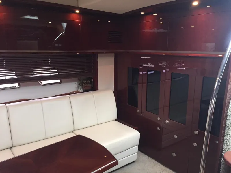 Slide: The Image of 2008 Sea Ray 480 Sundancer yacht docked in a marina. - 12