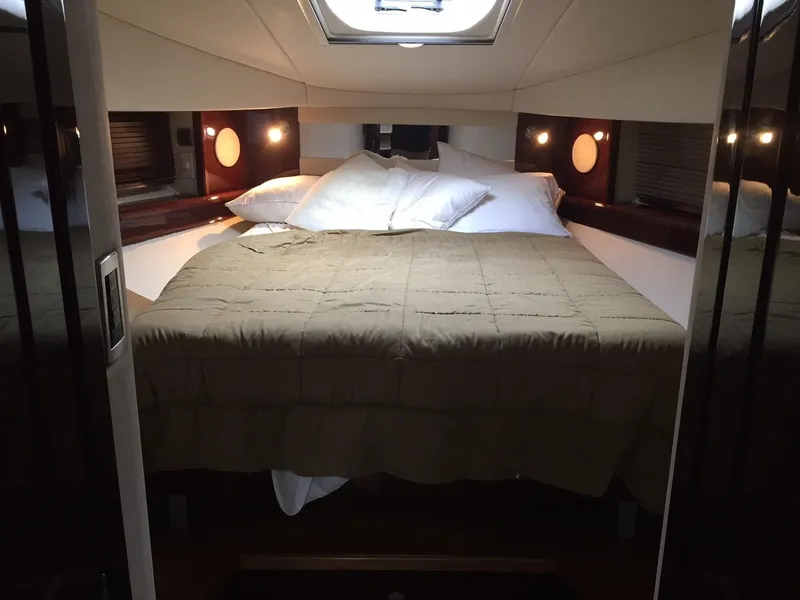 Slide: The Image of 2008 Sea Ray 480 Sundancer interior seating area with beige leather upholstery. - 19