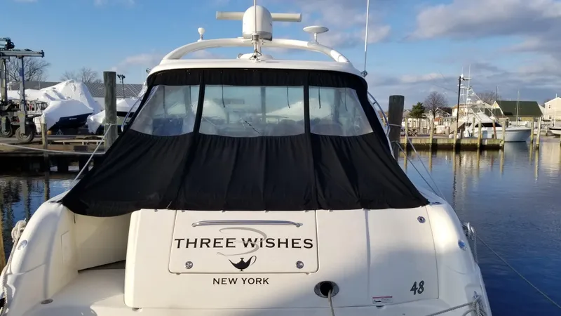 Slide: The Image of 2008 Sea Ray 480 Sundancer yacht cruising on open water. - 3