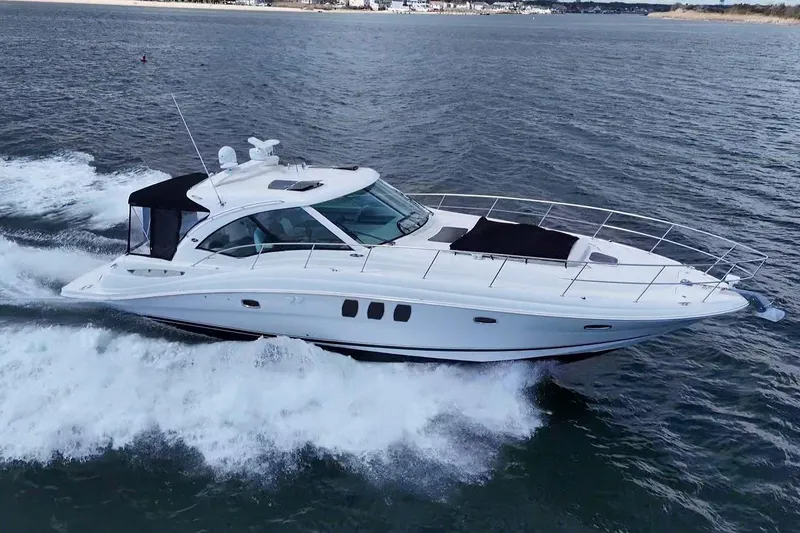 Slide: The Image of Interior cabin of 2008 Sea Ray 480 Sundancer with twin beds and ambient lighting. - 31