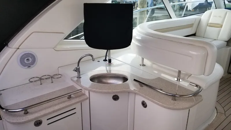 Slide: The Image of 2008 Sea Ray 480 Sundancer yacht cruising on open water under a partly cloudy sky. - 8