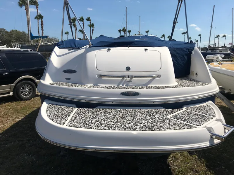 Slide: The Image of 2005 Chaparral Sunesta 252 boat with patterned deck, parked outdoors. - 2