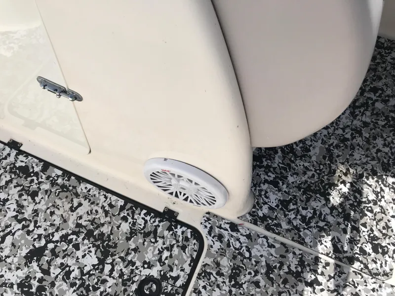 Slide: The Image of 2005 Chaparral Sunesta 252 boat interior with speaker and patterned flooring. - 20