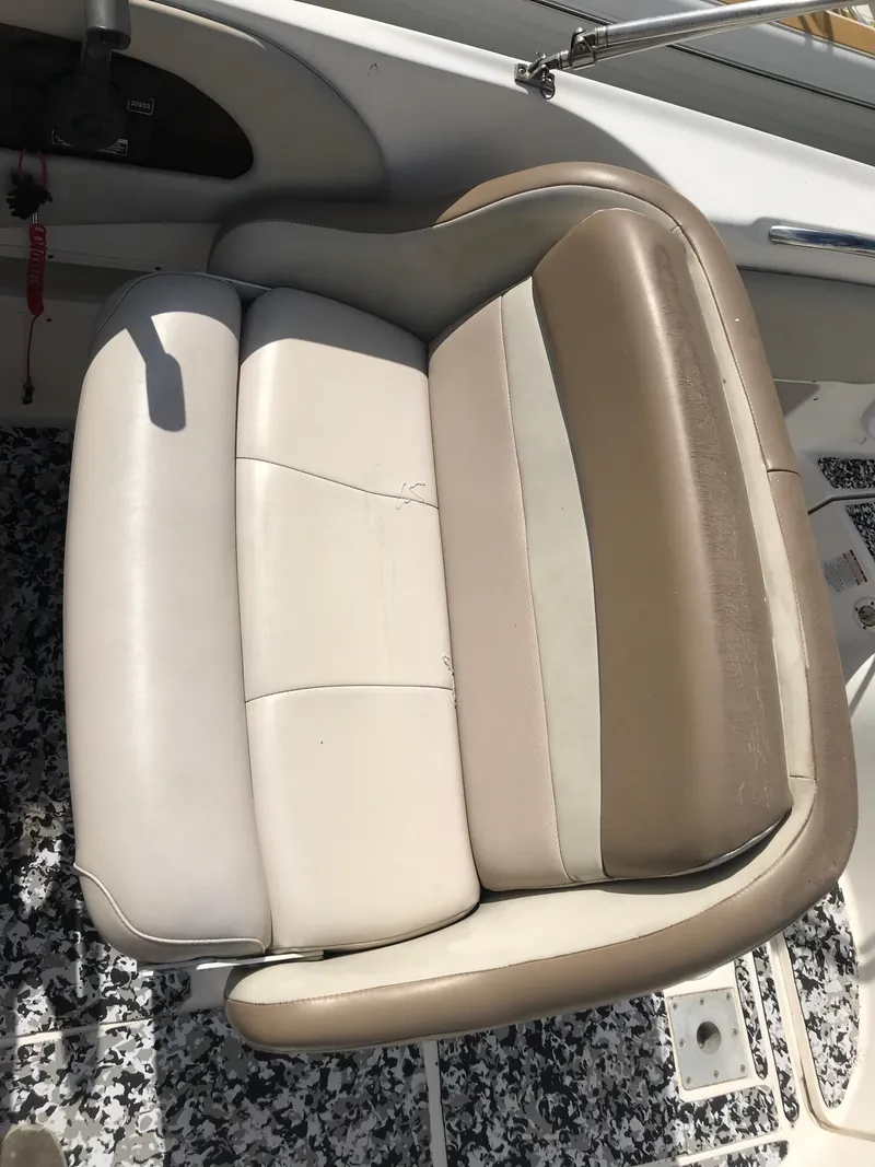 Slide: The Image of 2005 Chaparral Sunesta 252 boat seat with beige and cream upholstery. - 25