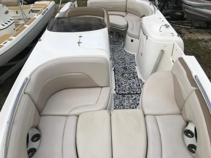 Slide: The Image of 2005 Chaparral Sunesta 252 boat interior with beige seating and patterned flooring. - 37