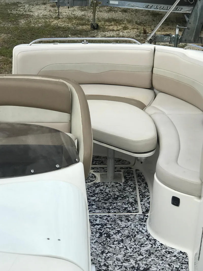 Slide: The Image of 2005 Chaparral Sunesta 252 boat interior with beige seating and patterned flooring. - 41