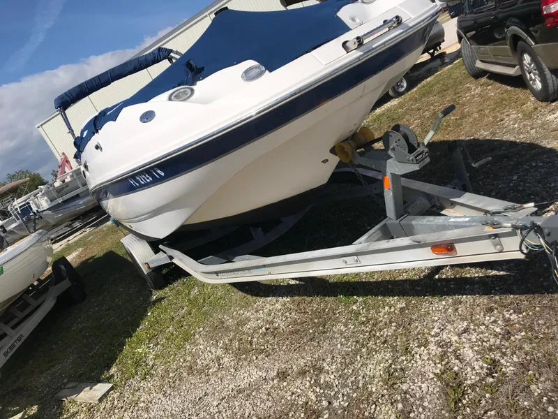 Slide: The Image of 2005 Chaparral Sunesta 252 boat on trailer in outdoor storage area. - 7