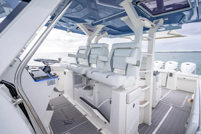 Slide: The Image of 2022 Pursuit 428S boat interior with luxurious seating and modern design. - 35