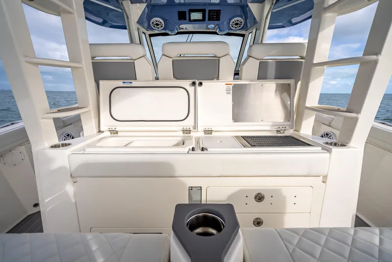 Slide: The Image of 2022 Pursuit 428S boat interior with seating and storage compartments. - 48