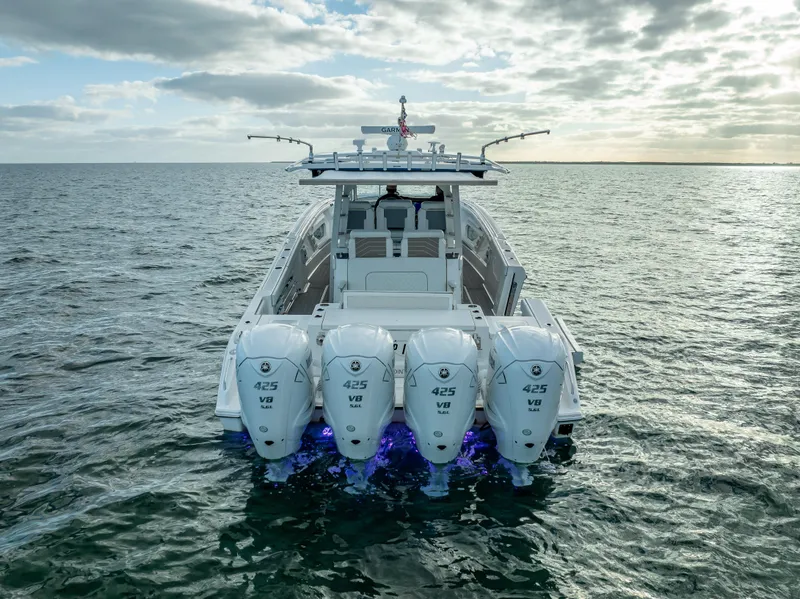 Slide: The Image of 2022 Pursuit 428S boat with four Yamaha 425 V8 engines on open water. - 8