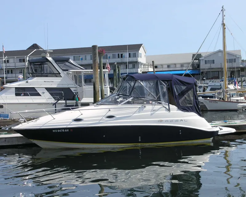 Slide: The Image of 2004 Regal 2665 Commodore Express boat docked at marina. - 1