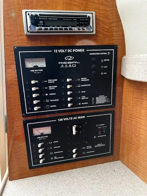 Slide: The Image of Control panel of a 2004 Regal 2665 Commodore Express boat. - 14