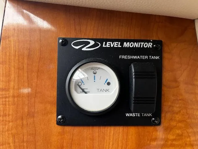 Slide: The Image of Level monitor for freshwater and waste tanks on a 2004 Regal 2665 Commodore Express. - 15