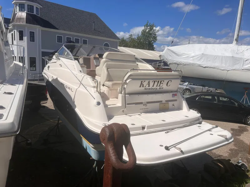 Slide: The Image of 2004 Regal 2665 Commodore Express boat docked, featuring "Katie C" nameplate, Newbury, MA. - 4