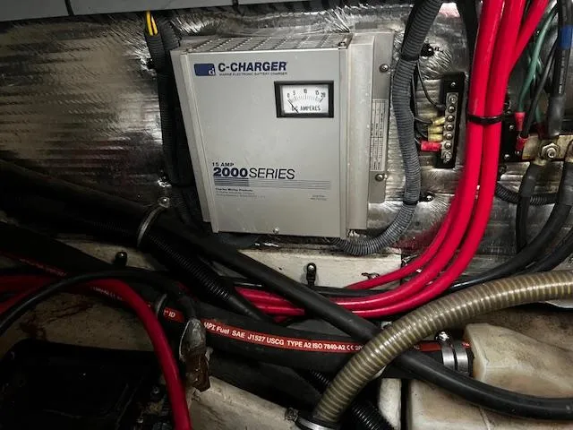 Slide: The Image of 2004 Regal 2665 Commodore Express engine compartment with C-Charger 2000 Series battery charger. - 26