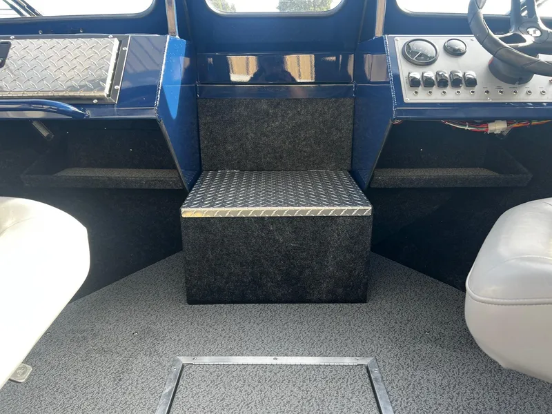 Slide: The Image of 2024 Thunder Jet 185 Luxor boat interior with control panel and seating. - 12