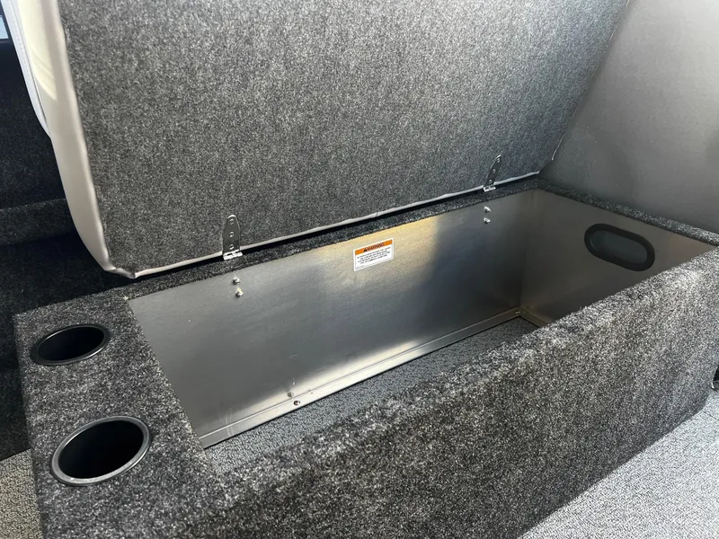 Slide: The Image of Open storage compartment in 2024 Thunder Jet 185 Luxor boat with cup holders. - 18