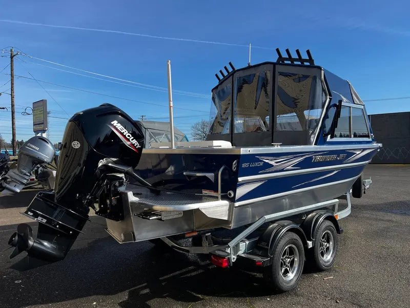 Slide: The Image of 2024 Thunder Jet 185 Luxor boat on trailer with Mercury outboard motor. - 2