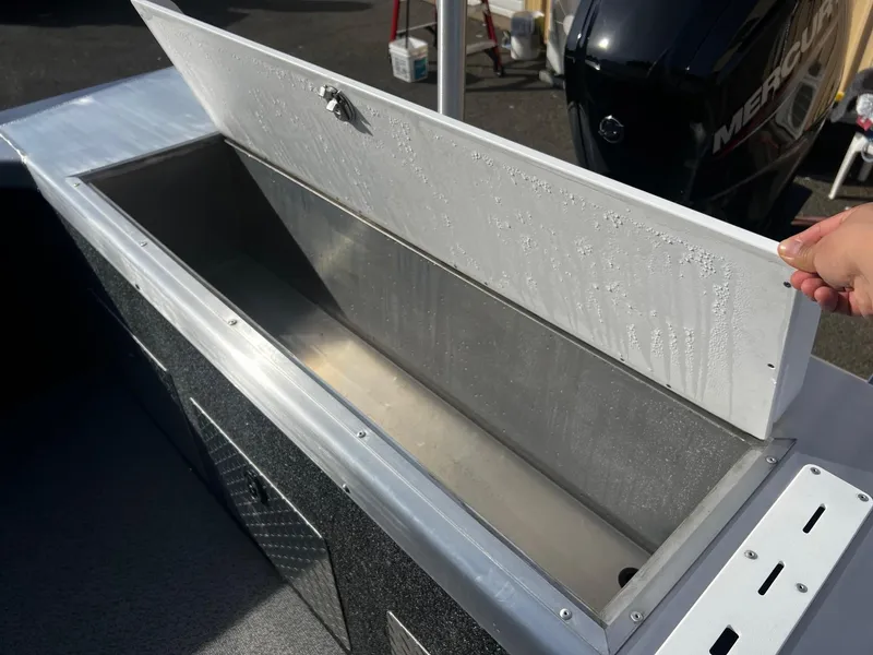 Slide: The Image of Open storage compartment on a 2024 Thunder Jet 185 Luxor boat. - 21