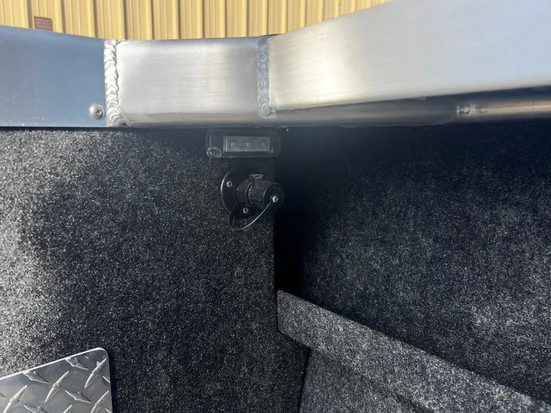 Slide: The Image of 2024 Thunder Jet 185 Luxor interior detail with carpeted walls and metal trim. - 23